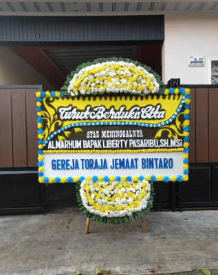 Papan Bunga Duka di Tangkil